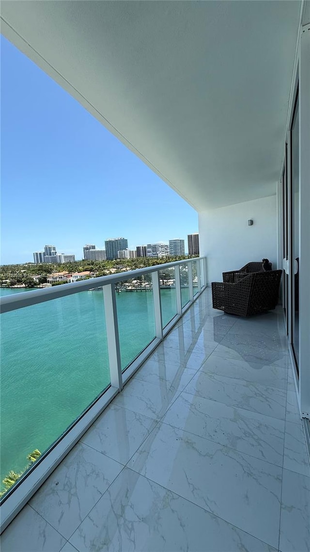 9821 E Bay Harbor Dr Unit 903, Bay Harbor Islands, FL 33154 - balcony with a city view and a water view