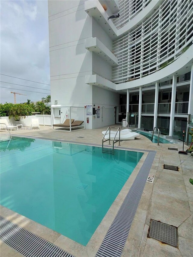 9821 E Bay Harbor Dr Unit 903, Bay Harbor Islands, FL 33154 - community pool with a patio