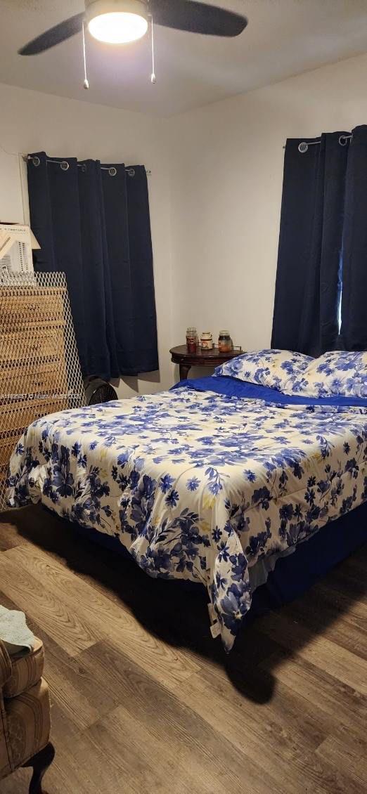 890 E 52nd St, Hialeah, FL 33013 - bedroom with wood finished floors and ceiling fan