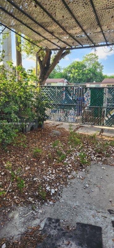 890 E 52nd St, Hialeah, FL 33013 - view of yard featuring a pergola
