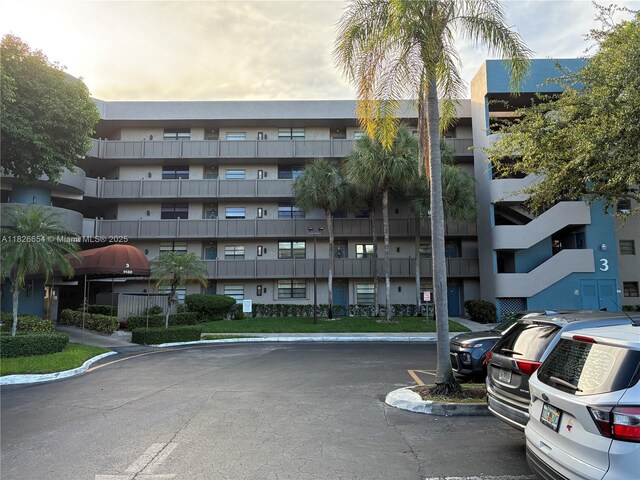 1100 Colony Point Cir Unit 504, Pembroke Pines, FL 33026 - view of apartment building / complex with uncovered parking