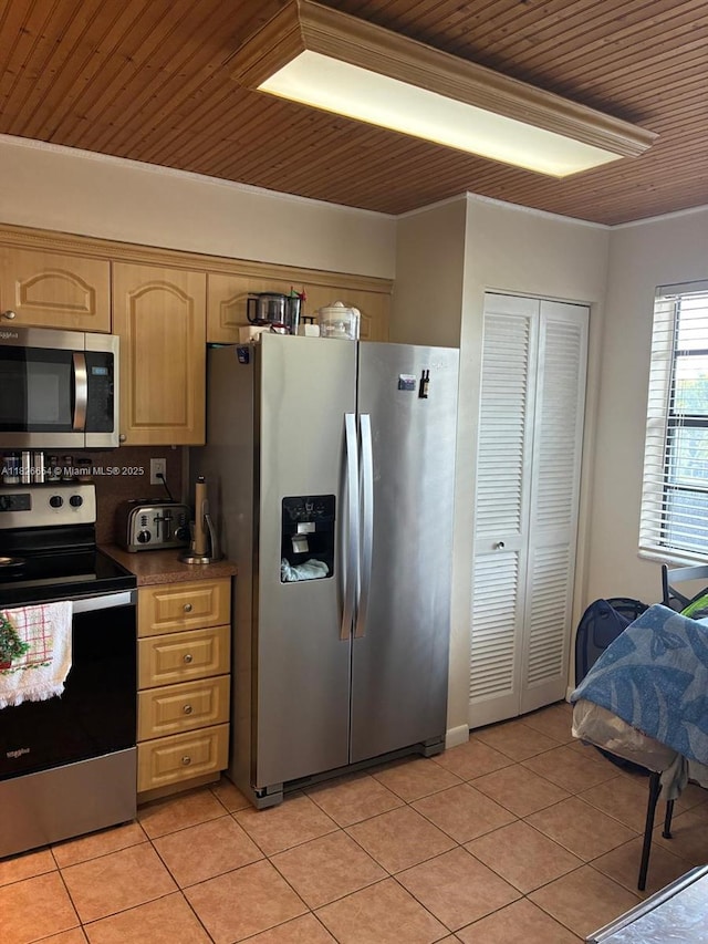 1100 Colony Point Cir Unit 504, Pembroke Pines, FL 33026 - kitchen featuring appliances with stainless steel finishes, light tile patterned floors, wood ceiling, and light brown cabinets