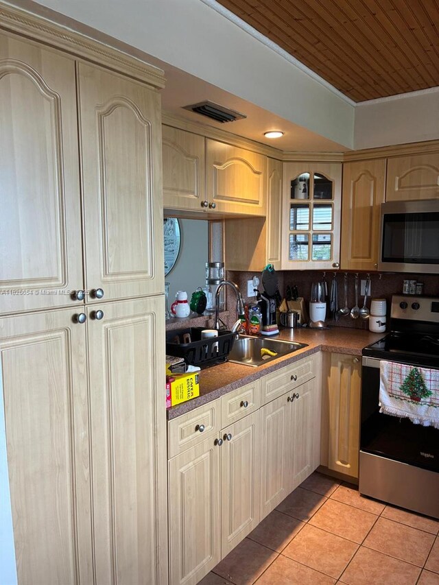 1100 Colony Point Cir Unit 504, Pembroke Pines, FL 33026 - kitchen with appliances with stainless steel finishes, light tile patterned floors, and wooden ceiling