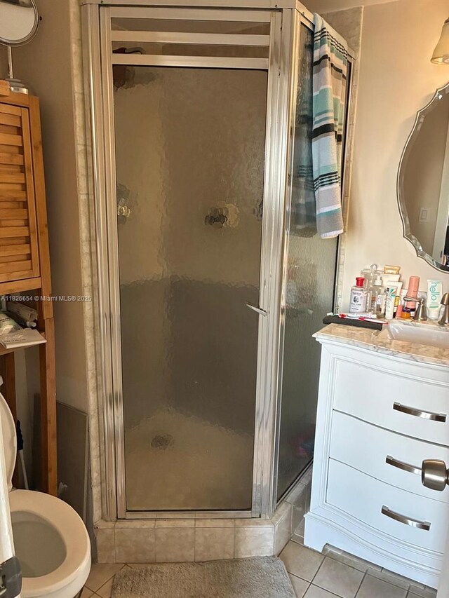 1100 Colony Point Cir Unit 504, Pembroke Pines, FL 33026 - bathroom with tile patterned flooring, vanity, and a shower stall
