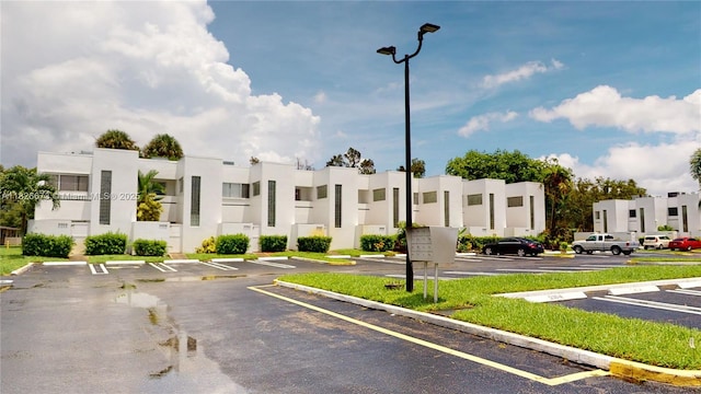5130 Elmhurst Rd Unit H, West Palm Beach, FL 33417 - view of property with uncovered parking and a residential view
