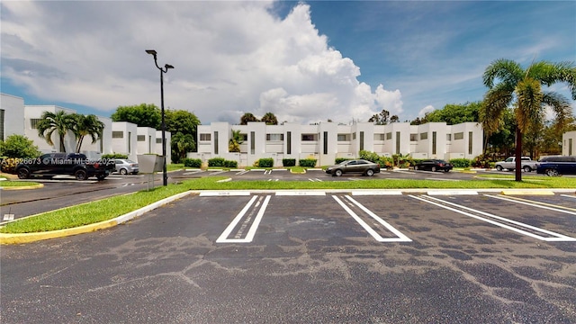 5130 Elmhurst Rd Unit H, West Palm Beach, FL 33417 - uncovered parking lot with a residential view