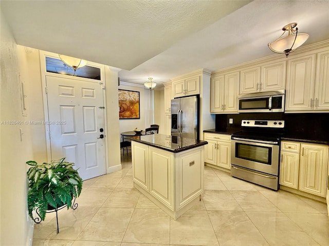 6404 Coral Lake Dr Unit 104, Margate, FL 33063 - kitchen with stainless steel appliances, cream cabinets, and a center island