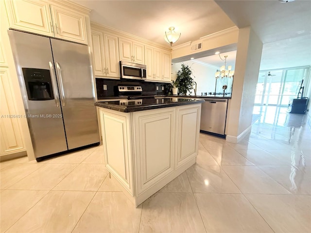 6404 Coral Lake Dr Unit 104, Margate, FL 33063 - kitchen featuring stainless steel appliances, ornamental molding, a chandelier, tasteful backsplash, and light tile patterned floors