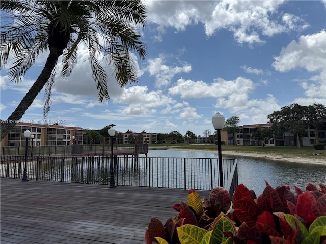 6404 Coral Lake Dr Unit 104, Margate, FL 33063 - dock area featuring a water view