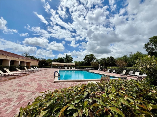 6404 Coral Lake Dr Unit 104, Margate, FL 33063 - community pool with a patio area