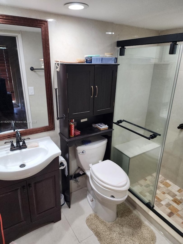 6311 NW 71st Ave, Tamarac, FL 33321 - bathroom featuring vanity, a shower stall, and tile patterned floors