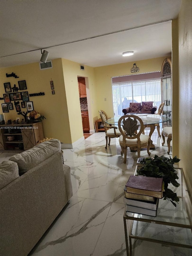 6311 NW 71st Ave, Tamarac, FL 33321 - living area featuring light marble finish flooring and baseboards