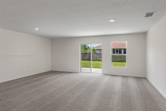 1230 Waterford, Palm Bay, FL 32909 - unfurnished room with carpet floors, a textured ceiling, and recessed lighting