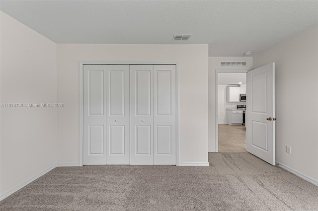 1230 Waterford, Palm Bay, FL 32909 - unfurnished bedroom featuring carpet flooring and a closet