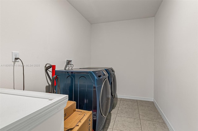 1230 Waterford, Palm Bay, FL 32909 - laundry room with washing machine and clothes dryer and light tile patterned flooring
