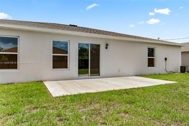1230 Waterford, Palm Bay, FL 32909 - back of house with stucco siding, a patio area, and a lawn