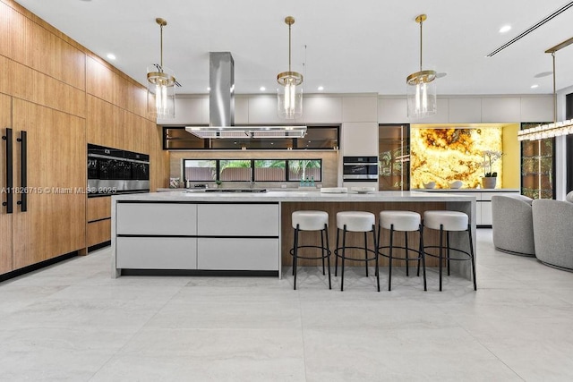 1132 SE 6th Ter, Fort Lauderdale, FL 33316 - kitchen featuring modern cabinets, stainless steel oven, island range hood, a breakfast bar area, and recessed lighting