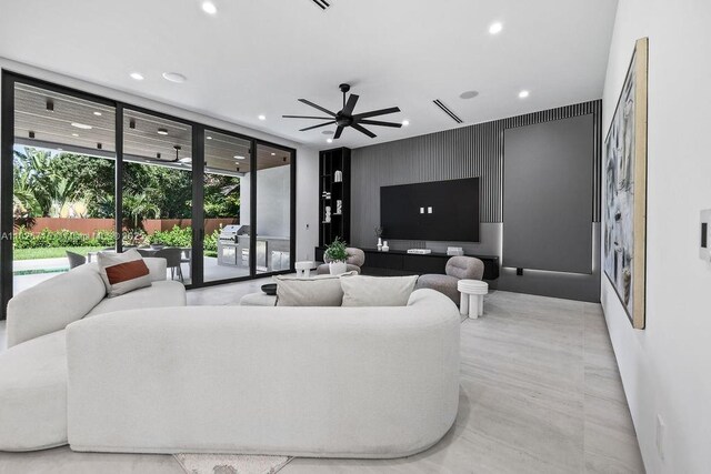 1132 SE 6th Ter, Fort Lauderdale, FL 33316 - living room with recessed lighting, ceiling fan, and a wall of windows