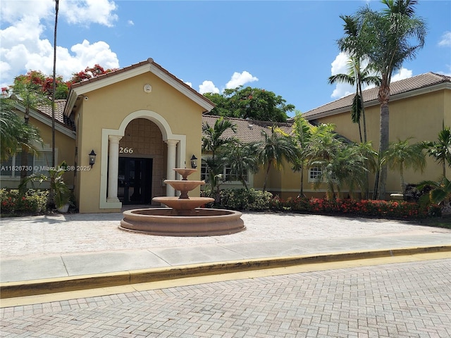 2640 S University Dr Unit 125, Davie, FL 33328 - view of front of house with stucco siding and a tile roof