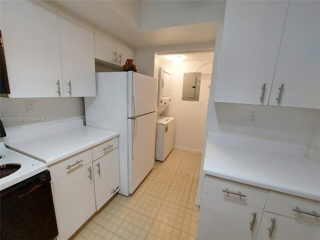 2640 S University Dr Unit 125, Davie, FL 33328 - kitchen with electric panel, electric range, freestanding refrigerator, estacked washer and dryer, and light countertops