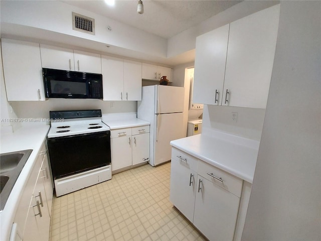 2640 S University Dr Unit 125, Davie, FL 33328 - kitchen featuring white appliances, light countertops, washer / clothes dryer, and white cabinets