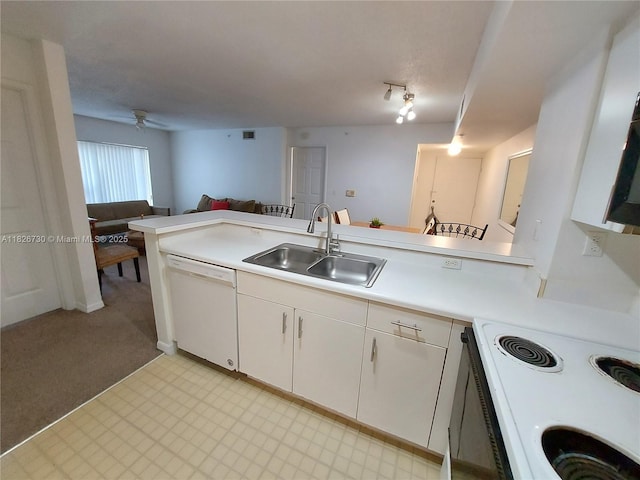 2640 S University Dr Unit 125, Davie, FL 33328 - kitchen with white appliances, light countertops, open floor plan, white cabinets, and ceiling fan