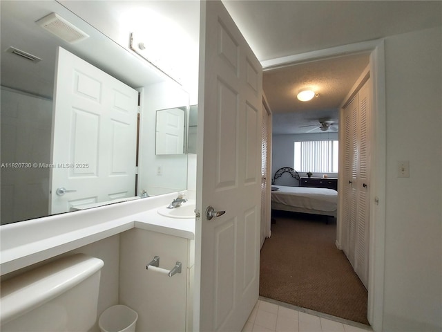 2640 S University Dr Unit 125, Davie, FL 33328 - ensuite bathroom featuring vanity, a ceiling fan, and tile patterned flooring