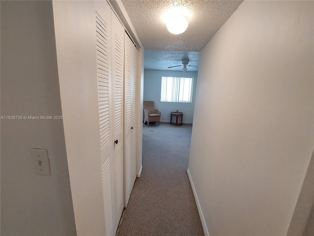 2640 S University Dr Unit 125, Davie, FL 33328 - corridor featuring a textured ceiling and carpet