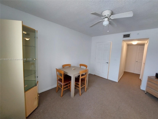 2640 S University Dr Unit 125, Davie, FL 33328 - carpeted dining space with a ceiling fan and a textured ceiling