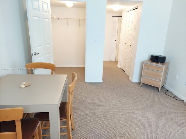 2640 S University Dr Unit 125, Davie, FL 33328 - carpeted dining space with baseboards