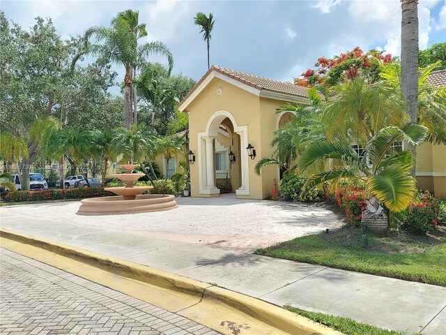 2640 S University Dr Unit 125, Davie, FL 33328 - mediterranean / spanish-style home with stucco siding and a tiled roof