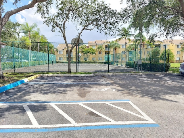 2640 S University Dr Unit 125, Davie, FL 33328 - uncovered parking lot with a tennis court and a residential view