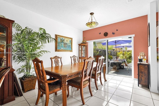 14783 SW 143rd Ter, Miami, FL 33196 - dining space with a textured ceiling and light tile patterned floors