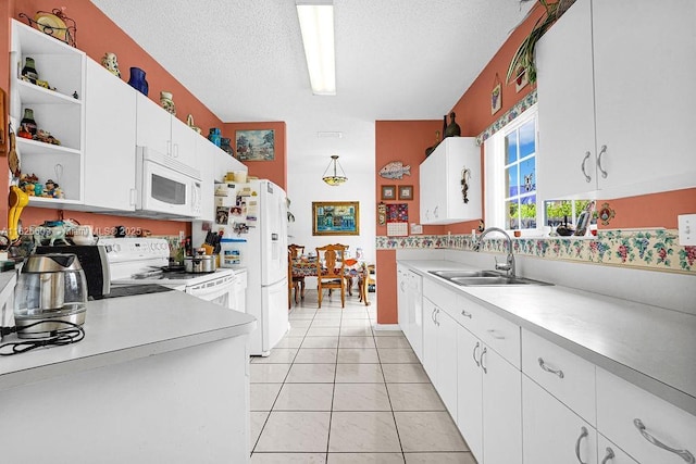 14783 SW 143rd Ter, Miami, FL 33196 - kitchen featuring white appliances, open shelves, light countertops, white cabinetry, and a textured ceiling