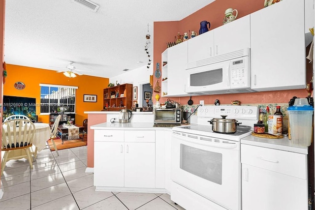 14783 SW 143rd Ter, Miami, FL 33196 - kitchen featuring white appliances, a peninsula, light countertops, a ceiling fan, and a textured ceiling