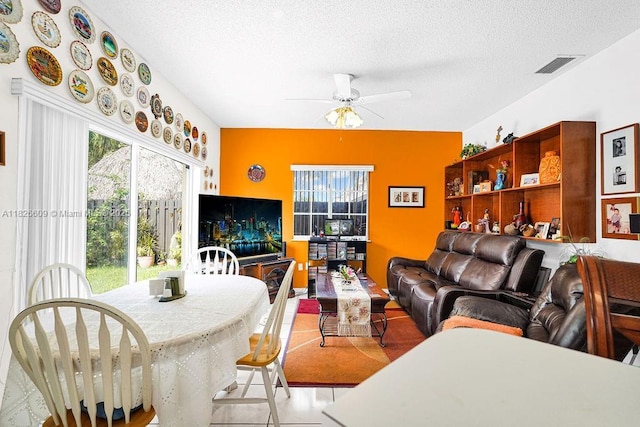 14783 SW 143rd Ter, Miami, FL 33196 - living room featuring ceiling fan and a textured ceiling