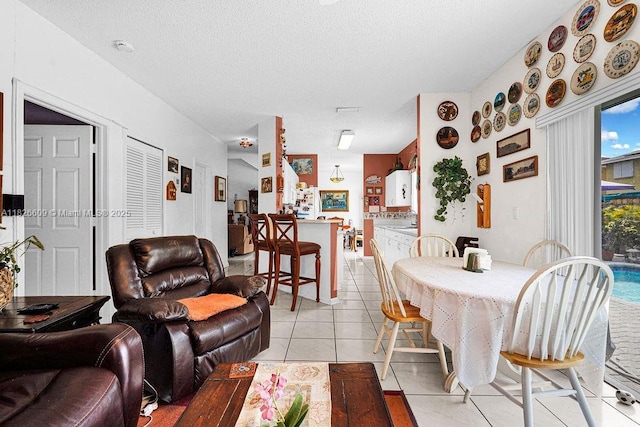 14783 SW 143rd Ter, Miami, FL 33196 - living area featuring light tile patterned floors and a textured ceiling