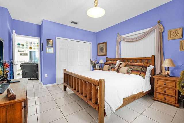 14783 SW 143rd Ter, Miami, FL 33196 - bedroom featuring light tile patterned floors and a closet