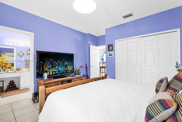 14783 SW 143rd Ter, Miami, FL 33196 - bedroom with light tile patterned floors, a closet, and ensuite bath