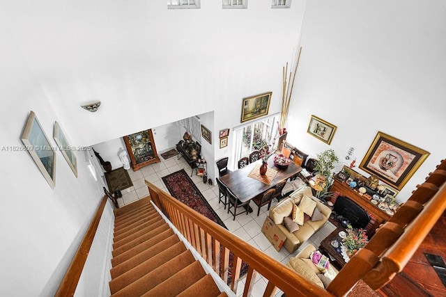 14783 SW 143rd Ter, Miami, FL 33196 - staircase featuring a high ceiling and tile patterned floors