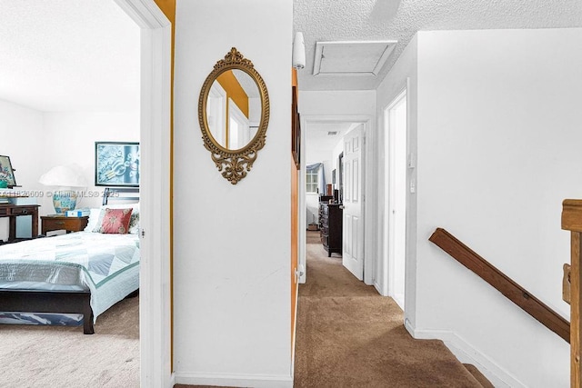 14783 SW 143rd Ter, Miami, FL 33196 - hallway with carpet, attic access, a textured ceiling, and an upstairs landing