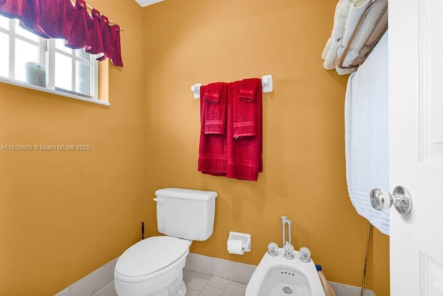 14783 SW 143rd Ter, Miami, FL 33196 - bathroom with a bidet and tile patterned flooring