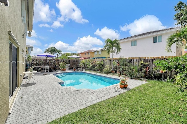 14783 SW 143rd Ter, Miami, FL 33196 - view of swimming pool featuring a patio and a fenced backyard