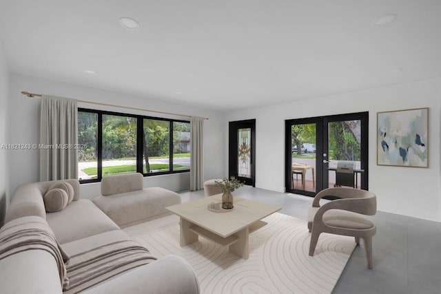 220 NE 105th St, Miami Shores, FL 33138 - living room with french doors, healthy amount of natural light, and recessed lighting