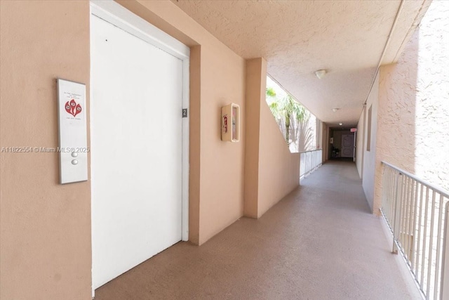 9481 Evergreen Pl Unit 206, Davie, FL 33324 - hall featuring a textured ceiling and elevator