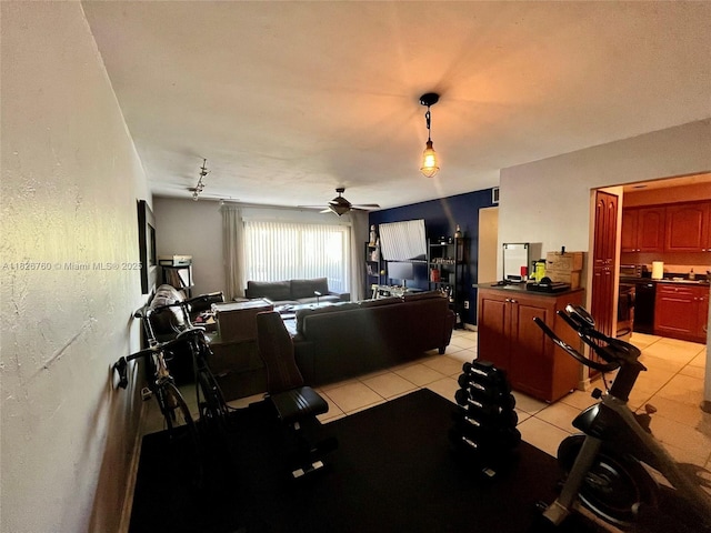 8325 SW 72nd Ave Unit 214C, Miami, FL 33143 - exercise room with ceiling fan and light tile patterned floors