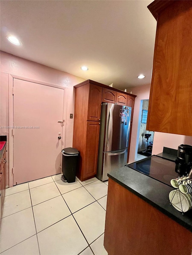 8325 SW 72nd Ave Unit 214C, Miami, FL 33143 - kitchen featuring freestanding refrigerator, range, recessed lighting, dark countertops, and light tile patterned flooring