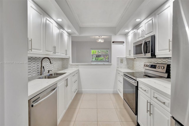 13800 SW 5th Ct Unit 101M, Pembroke Pines, FL 33027 - kitchen with stainless steel appliances, recessed lighting, tasteful backsplash, white cabinets, and crown molding
