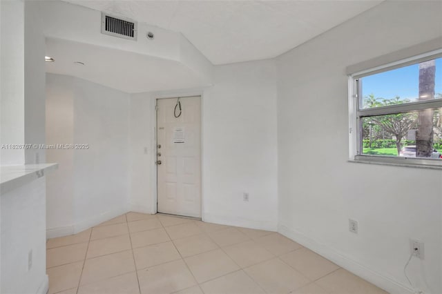 13800 SW 5th Ct Unit 101M, Pembroke Pines, FL 33027 - spare room with baseboards and light tile patterned floors