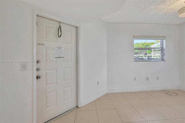 13800 SW 5th Ct Unit 101M, Pembroke Pines, FL 33027 - entryway with baseboards and light tile patterned flooring